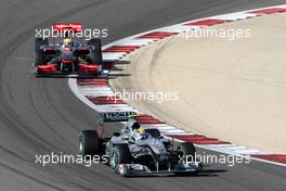 14.03.2010 Sakhir, Bahrain,  Nico Rosberg (GER), Mercedes GP Petronas, W01 leads Lewis Hamilton (GBR), McLaren Mercedes, MP4-25 - Formula 1 World Championship, Rd 1, Bahrain Grand Prix, Sunday Race