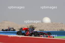 13.03.2010 Sakhir, Bahrain,  Jenson Button (GBR), McLaren Mercedes and Michael Schumacher (GER), Mercedes GP  - Formula 1 World Championship, Rd 1, Bahrain Grand Prix, Saturday Qualifying