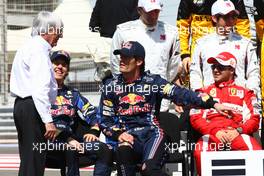 14.03.2010 Sakhir, Bahrain,  Bernie Ecclestone (GBR) with Sebastian Vettel (GER), Red Bull Racing and Mark Webber (AUS), Red Bull Racing - Formula 1 World Championship, Rd 1, Bahrain Grand Prix, Sunday