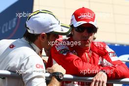 14.03.2010 Sakhir, Bahrain,  Jarno Trulli (ITA), Lotus F1 Team and Fernando Alonso (ESP), Scuderia Ferrari - Formula 1 World Championship, Rd 1, Bahrain Grand Prix, Sunday