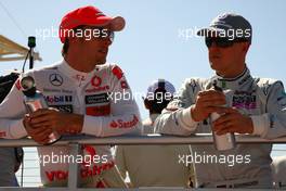 14.03.2010 Sakhir, Bahrain,  Jenson Button (GBR), McLaren Mercedes and Michael Schumacher (GER), Mercedes GP Petronas - Formula 1 World Championship, Rd 1, Bahrain Grand Prix, Sunday