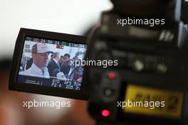 11.03.2010 Sakhir, Bahrain,  Michael Schumacher (GER), Mercedes GP Petronas does tv interviews - Formula 1 World Championship, Rd 1, Bahrain Grand Prix, Thursday
