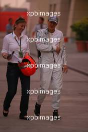 11.03.2010 Sakhir, Bahrain,  Sabine Kehm (GER), Michael Schumacher's press officer with Michael Schumacher (GER), Mercedes GP Petronas - Formula 1 World Championship, Rd 1, Bahrain Grand Prix, Thursday