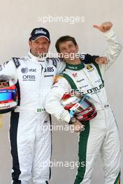 11.03.2010 Sakhir, Bahrain,  Rubens Barrichello (BRA), Williams F1 Team and Jarno Trulli (ITA), Lotus F1 Team  - Formula 1 World Championship, Rd 1, Bahrain Grand Prix, Thursday