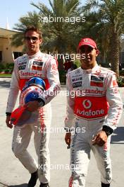 11.03.2010 Sakhir, Bahrain,  Jenson Button (GBR), McLaren Mercedes and Lewis Hamilton (GBR), McLaren Mercedes - Formula 1 World Championship, Rd 1, Bahrain Grand Prix, Thursday