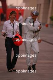 11.03.2010 Sakhir, Bahrain,  Sabine Kehm (GER), Michael Schumacher's press officer with Michael Schumacher (GER), Mercedes GP Petronas - Formula 1 World Championship, Rd 1, Bahrain Grand Prix, Thursday