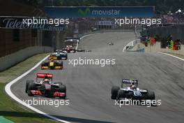 07.11.2010 Sao Paulo, Brazil,  Lewis Hamilton (GBR), McLaren Mercedes and Nico Hulkenberg (GER), Williams F1 Team  - Formula 1 World Championship, Rd 18, Brazilian Grand Prix, Sunday Race