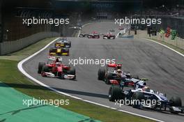 07.11.2010 Sao Paulo, Brazil,  Nico Hulkenberg (GER), Williams F1 Team leads Fernando Alonso (ESP), Scuderia Ferrari and Lewis Hamilton (GBR), McLaren Mercedes - Formula 1 World Championship, Rd 18, Brazilian Grand Prix, Sunday Race