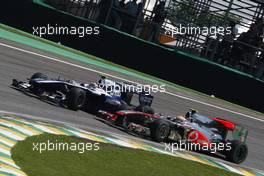 07.11.2010 Sao Paulo, Brazil,  Nico Hulkenberg (GER), Williams F1 Team and Lewis Hamilton (GBR), McLaren Mercedes - Formula 1 World Championship, Rd 18, Brazilian Grand Prix, Sunday Race