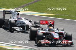 07.11.2010 Sao Paulo, Brazil,  Lewis Hamilton (GBR), McLaren Mercedes leads Kamui Kobayashi (JAP), BMW Sauber F1 Team - Formula 1 World Championship, Rd 18, Brazilian Grand Prix, Sunday Race