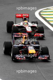 06.11.2010 Sao Paulo, Brazil,  Sebastian Vettel (GER), Red Bull Racing leads Lewis Hamilton (GBR), McLaren Mercedes, MP4-25 - Formula 1 World Championship, Rd 18, Brazilian Grand Prix, Saturday Qualifying