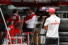 04.11.2010 Sao Paulo, Brazil,  Lewis Hamilton (GBR), McLaren Mercedes watches the ferrari team at work n- Formula 1 World Championship, Rd 18, Brazilian Grand Prix, Thursday