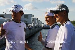 11.06.2010 Montreal, Canada,  Adrian Sutil (GER), Force India F1 Team, Nico Rosberg (GER), Mercedes GP and Michael Schumacher (GER), Mercedes GP supporting German football team - Formula 1 World Championship, Rd 8, Canadian Grand Prix, Friday