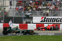 12.06.2010 Montreal, Canada,  Heikki Kovalainen (FIN), Lotus F1 Team  passes Lucas di Grassi (BRA), Virgin Racing spin out of the track - Formula 1 World Championship, Rd 8, Canadian Grand Prix, Saturday Practice