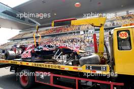 16.04.2010 Shanghai, China,  The damaged car of Sébastien Buemi (SUI), Scuderia Toro Rosso is returned to the pits - Formula 1 World Championship, Rd 4, Chinese Grand Prix, Friday