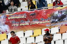 16.04.2010 Shanghai, China,  Fans with Banners for Michael Schumacher (GER), Mercedes GP Petronas - Formula 1 World Championship, Rd 4, Chinese Grand Prix, Friday Practice