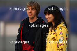 16.04.2010 Shanghai, China,  Sebastian Vettel (GER), Red Bull Racing with a fan - Formula 1 World Championship, Rd 4, Chinese Grand Prix, Friday