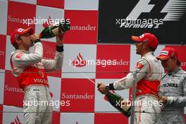18.04.2010 Shanghai, China,  1st place Jenson Button (GBR), McLaren Mercedes with 2nd place Lewis Hamilton (GBR), McLaren Mercedes - Formula 1 World Championship, Rd 4, Chinese Grand Prix, Sunday Podium