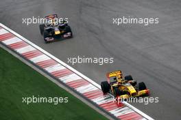 18.04.2010 Shanghai, China,  Robert Kubica (POL), Renault F1 Team, R30 leads Sebastian Vettel (GER), Red Bull Racing, RB6 - Formula 1 World Championship, Rd 4, Chinese Grand Prix, Sunday Race
