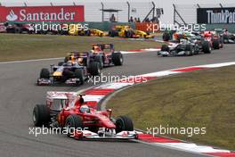 18.04.2010 Shanghai, China,  Fernando Alonso (ESP), Scuderia Ferrari, F10 leads Mark Webber (AUS), Red Bull Racing, RB6 at the start of the race - Formula 1 World Championship, Rd 4, Chinese Grand Prix, Sunday Race