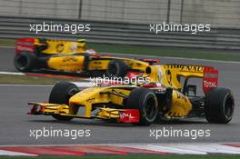18.04.2010 Shanghai, China,  Robert Kubica (POL), Renault F1 Team leads Vitaly Petrov (RUS), Renault F1 Team - Formula 1 World Championship, Rd 4, Chinese Grand Prix, Sunday Race