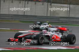18.04.2010 Shanghai, China,  Jenson Button (GBR), McLaren Mercedes, MP4-25 leads Nico Rosberg (GER), Mercedes GP Petronas - Formula 1 World Championship, Rd 4, Chinese Grand Prix, Sunday Race
