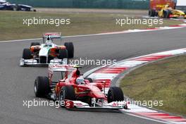 18.04.2010 Shanghai, China,  Fernando Alonso (ESP), Scuderia Ferrari, F10 leads Adrian Sutil (GER), Force India F1 Team, VJM-02 - Formula 1 World Championship, Rd 4, Chinese Grand Prix, Sunday Race