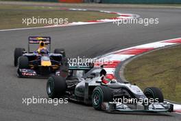 18.04.2010 Shanghai, China,  Michael Schumacher (GER), Mercedes GP Petronas, W01 leads Mark Webber (AUS), Red Bull Racing, RB6 - Formula 1 World Championship, Rd 4, Chinese Grand Prix, Sunday Race
