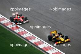 18.04.2010 Shanghai, China,  Vitaly Petrov (RUS), Renault F1 Team, R30 leads Felipe Massa (BRA), Scuderia Ferrari, F10 - Formula 1 World Championship, Rd 4, Chinese Grand Prix, Sunday Race