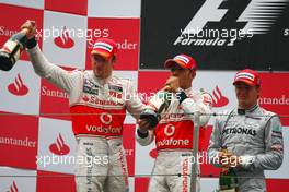 18.04.2010 Shanghai, China,  1st place Jenson Button (GBR), McLaren Mercedes with 2nd place Lewis Hamilton (GBR), McLaren Mercedes and 3rd place Nico Rosberg (GER), Mercedes GP Petronas - Formula 1 World Championship, Rd 4, Chinese Grand Prix, Sunday Race