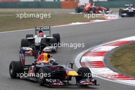 18.04.2010 Shanghai, China,  Sebastian Vettel (GER), Red Bull Racing, RB6 leads Michael Schumacher (GER), Mercedes GP Petronas, W01 - Formula 1 World Championship, Rd 4, Chinese Grand Prix, Sunday Race