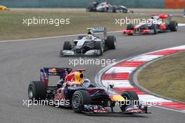 18.04.2010 Shanghai, China,  Sebastian Vettel (GER), Red Bull Racing, RB6 leads Nico Rosberg (GER), Mercedes GP Petronas, W01 - Formula 1 World Championship, Rd 4, Chinese Grand Prix, Sunday Race