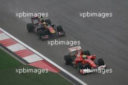 18.04.2010 Shanghai, China,  Felipe Massa (BRA), Scuderia Ferrari, F10 leads Jaime Alguersuari (ESP), Scuderia Toro Rosso, STR05 - Formula 1 World Championship, Rd 4, Chinese Grand Prix, Sunday Race