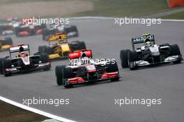 18.04.2010 Shanghai, China,  Jenson Button (GBR), McLaren Mercedes, MP4-25 leads Nico Rosberg (GER), Mercedes GP Petronas, W01 - Formula 1 World Championship, Rd 4, Chinese Grand Prix, Sunday Race