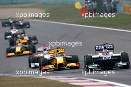 18.04.2010 Shanghai, China,  Rubens Barrichello (BRA), Williams F1 Team, FW32 leads Robert Kubica (POL), Renault F1 Team, R30 - Formula 1 World Championship, Rd 4, Chinese Grand Prix, Sunday Race
