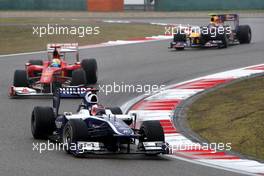 18.04.2010 Shanghai, China,  Rubens Barrichello (BRA), Williams F1 Team, FW32 leads Felipe Massa (BRA), Scuderia Ferrari, F10 - Formula 1 World Championship, Rd 4, Chinese Grand Prix, Sunday Race