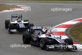 18.04.2010 Shanghai, China,  Rubens Barrichello (BRA), Williams F1 Team, FW32 leads Nico Hulkenberg (GER), Williams F1 Team - Formula 1 World Championship, Rd 4, Chinese Grand Prix, Sunday Race