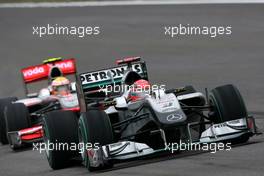 18.04.2010 Shanghai, China,  Michael Schumacher (GER), Mercedes GP Petronas, W01 leads Lewis Hamilton (GBR), McLaren Mercedes, MP4-25 - Formula 1 World Championship, Rd 4, Chinese Grand Prix, Sunday Race