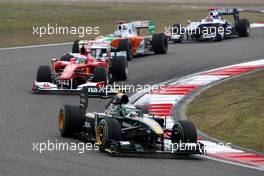 18.04.2010 Shanghai, China,  Heikki Kovalainen (FIN), Lotus F1 Team, T127 leads Fernando Alonso (ESP), Scuderia Ferrari, F10 - Formula 1 World Championship, Rd 4, Chinese Grand Prix, Sunday Race