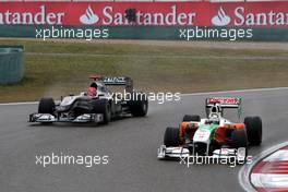 18.04.2010 Shanghai, China,  Adrian Sutil (GER), Force India F1 Team, VJM-02 leads Michael Schumacher (GER), Mercedes GP Petronas, W01 - Formula 1 World Championship, Rd 4, Chinese Grand Prix, Sunday Race