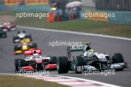 18.04.2010 Shanghai, China,  Nico Rosberg (GER), Mercedes GP Petronas, W01 leads Jenson Button (GBR), McLaren Mercedes, MP4-25 - Formula 1 World Championship, Rd 4, Chinese Grand Prix, Sunday Race
