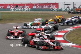 18.04.2010 Shanghai, China,  Jenson Button (GBR), McLaren Mercedes leads Lewis Hamilton (GBR), McLaren Mercedes - Formula 1 World Championship, Rd 4, Chinese Grand Prix, Sunday Race