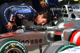 17.04.2010 Shanghai, China,  Mark Webber (AUS), Red Bull Racing takes a look at the McLaren - Formula 1 World Championship, Rd 4, Chinese Grand Prix, Saturday Qualifying