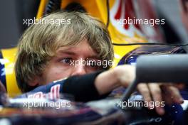 17.04.2010 Shanghai, China,  Sebastian Vettel (GER), Red Bull Racing, adjusts his new wing mirror - Formula 1 World Championship, Rd 4, Chinese Grand Prix, Saturday Practice