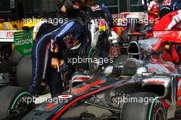 17.04.2010 Shanghai, China,  Sebastian Vettel (GER), Red Bull Racing takes a look at the McLaren - Formula 1 World Championship, Rd 4, Chinese Grand P - Formula 1 World Championship, Rd 4, Chinese Grand Prix, Saturday Qualifying