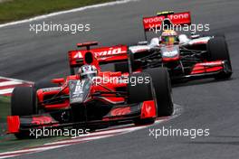 07.05.2010 Barcelona, Spain,  Timo Glock (GER), Virgin Racing VR-01 leads Lewis Hamilton (GBR), McLaren Mercedes, MP4-25 - Formula 1 World Championship, Rd 5, Spanish Grand Prix, Friday Practice