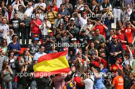 09.05.2010 Barcelona, Spain,  Mark Webber (AUS), Red Bull Racing throws his helmet into the crowd - Formula 1 World Championship, Rd 5, Spanish Grand Prix, Sunday Podium