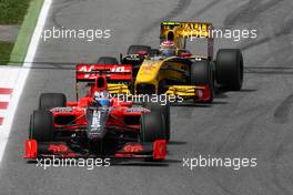 09.05.2010 Barcelona, Spain,  Timo Glock (GER), Virgin Racing VR-01 leads Vitaly Petrov (RUS), Renault F1 Team, R30 - Formula 1 World Championship, Rd 5, Spanish Grand Prix, Sunday Race