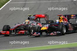 09.05.2010 Barcelona, Spain,  Sebastian Vettel (GER), Red Bull Racing and Lewis Hamilton (GBR), McLaren Mercedes goes out of the pits  - Formula 1 World Championship, Rd 5, Spanish Grand Prix, Sunday Race