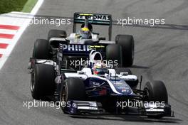 09.05.2010 Barcelona, Spain,  Nico Hulkenberg (GER), Williams F1 Team, FW32 leads Nico Rosberg (GER), Mercedes GP Petronas, W01 - Formula 1 World Championship, Rd 5, Spanish Grand Prix, Sunday Race